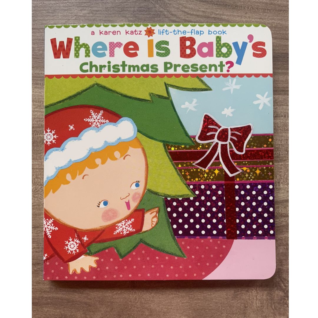 Where Is Baby's Christmas Present? (A Lift-the-Flap Board Book by Karen Katz)