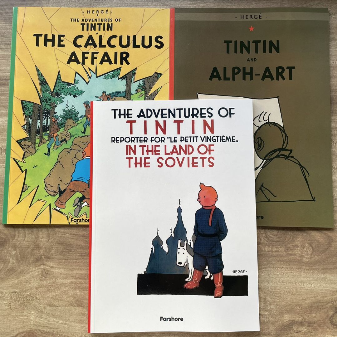 The Adventures of Tintin, 23 brand new softcover books, box set (BOX with slight DENTS, books no damage.)