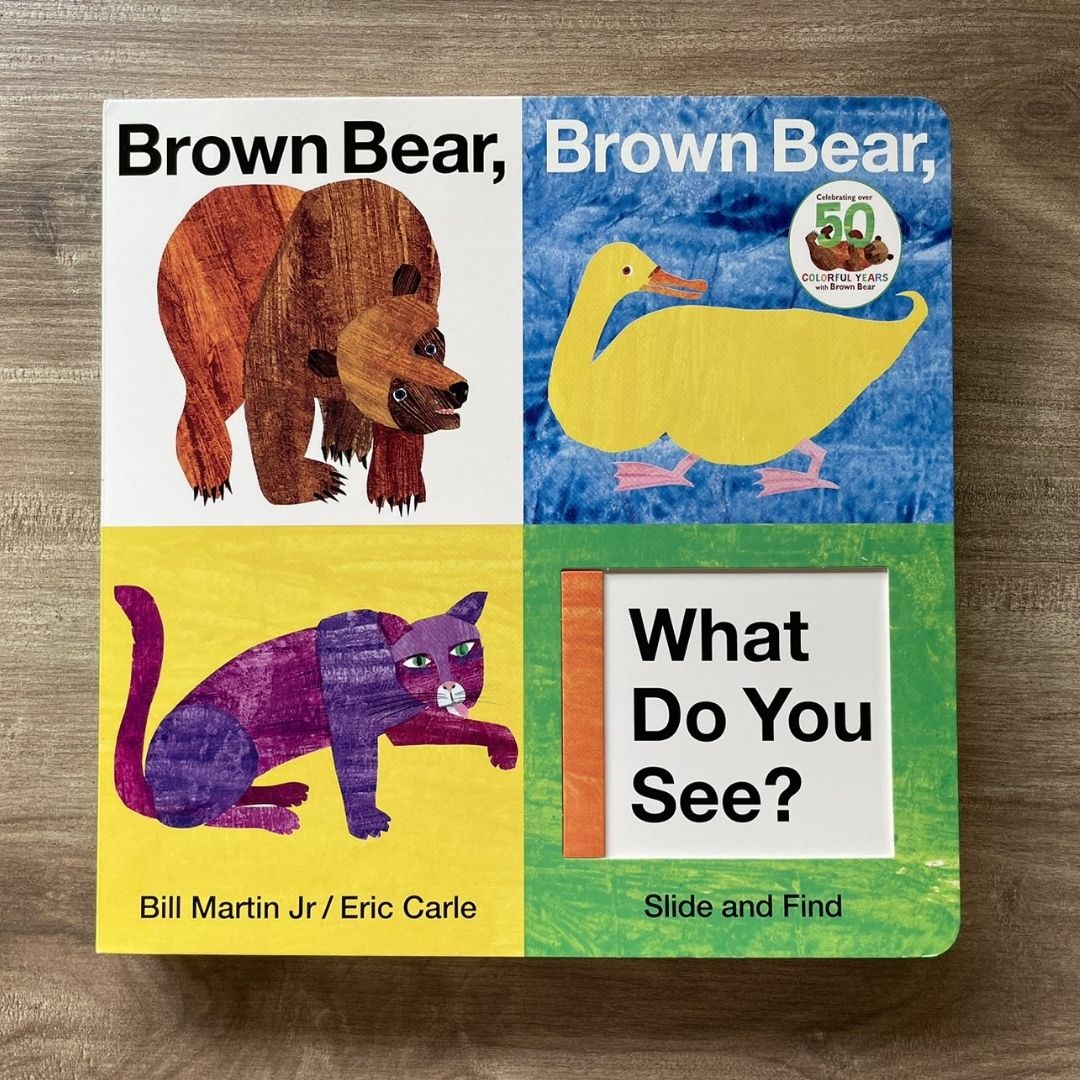 Brown Bear, Brown Bear, What Do You See? Slide and Find: An interactive board book (by Eric Carle) brand new, with SLIGHT DENTS on book cover
