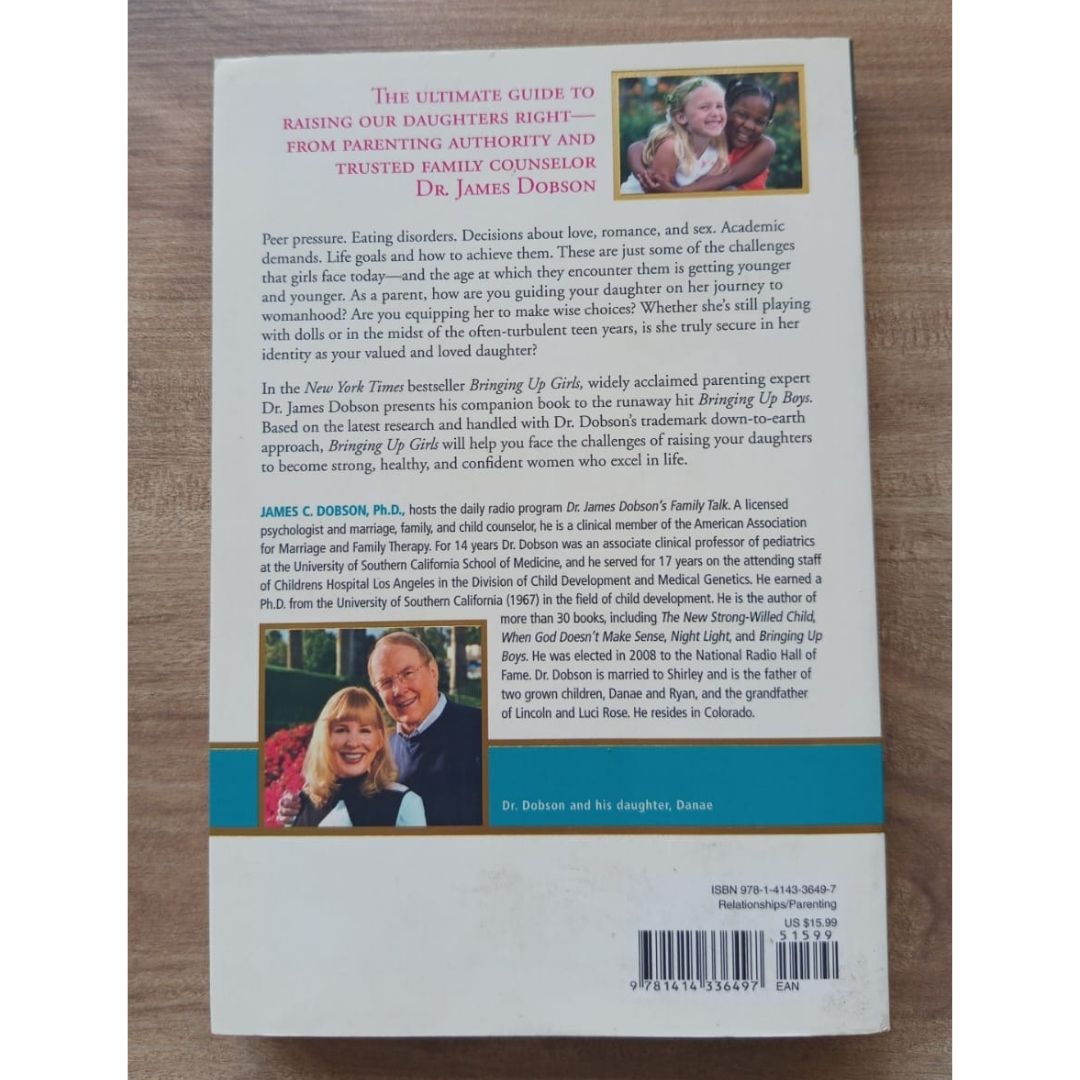 Bringing Up Girls: Practical Advice and Encouragement for Those Shaping the Next Generation of Women (by James C. Dobson) (USED book, softcover, with slight folds on book cover)